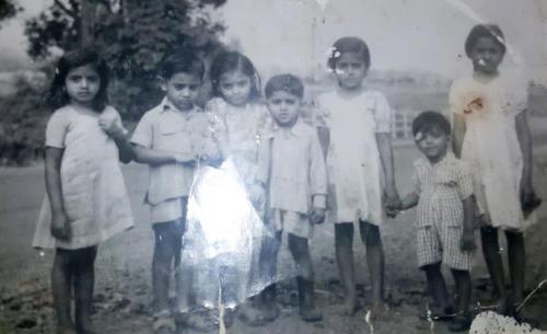 Zehra Suleman holding Kassim Suleman (3rd from the right)